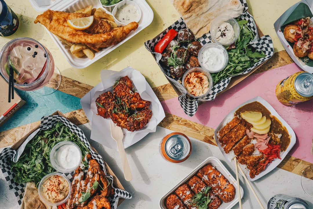 a-table-topped-with-plates-of-food-and-drinks-4u1zt2r2c5i